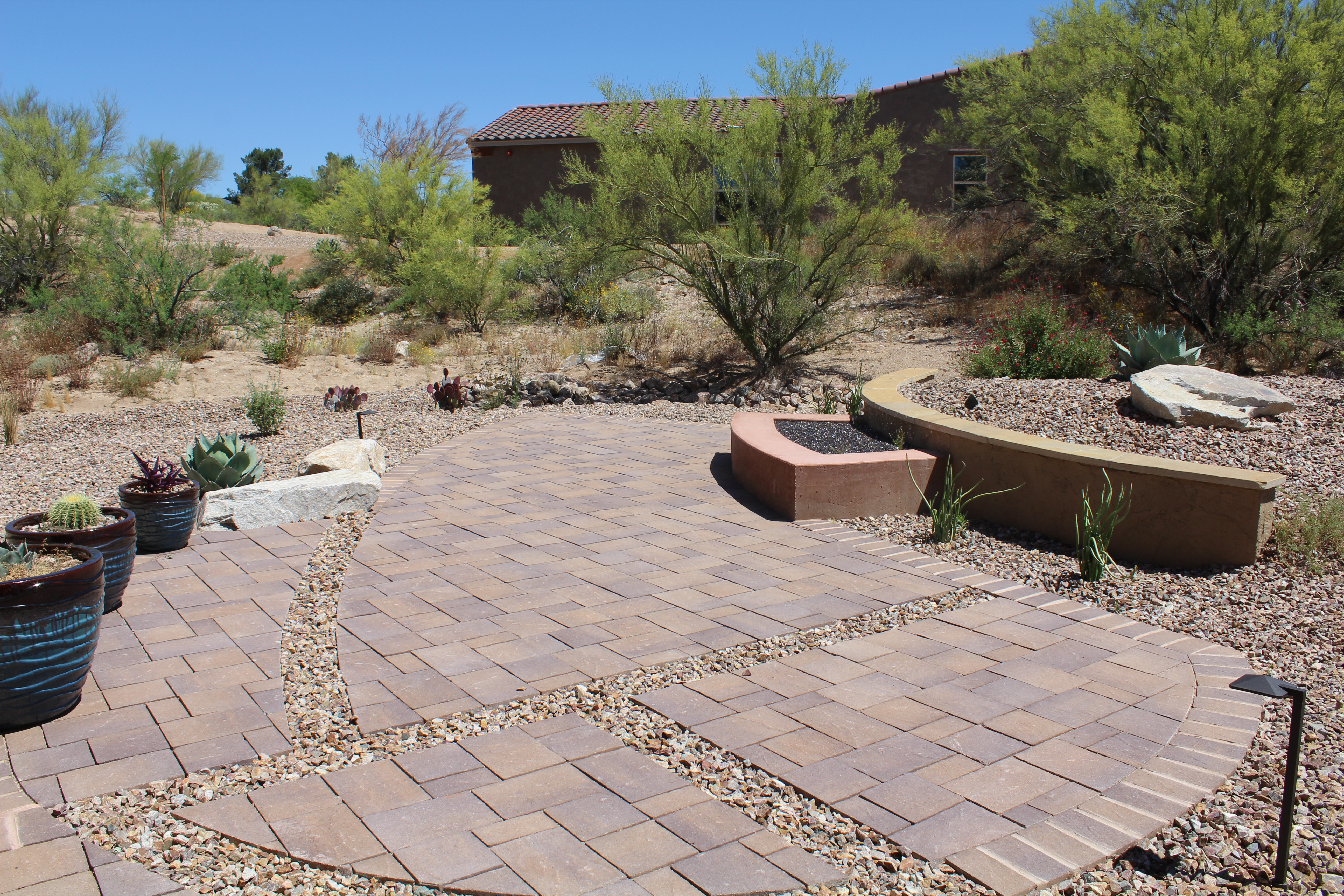 a backyard with a tiled patio